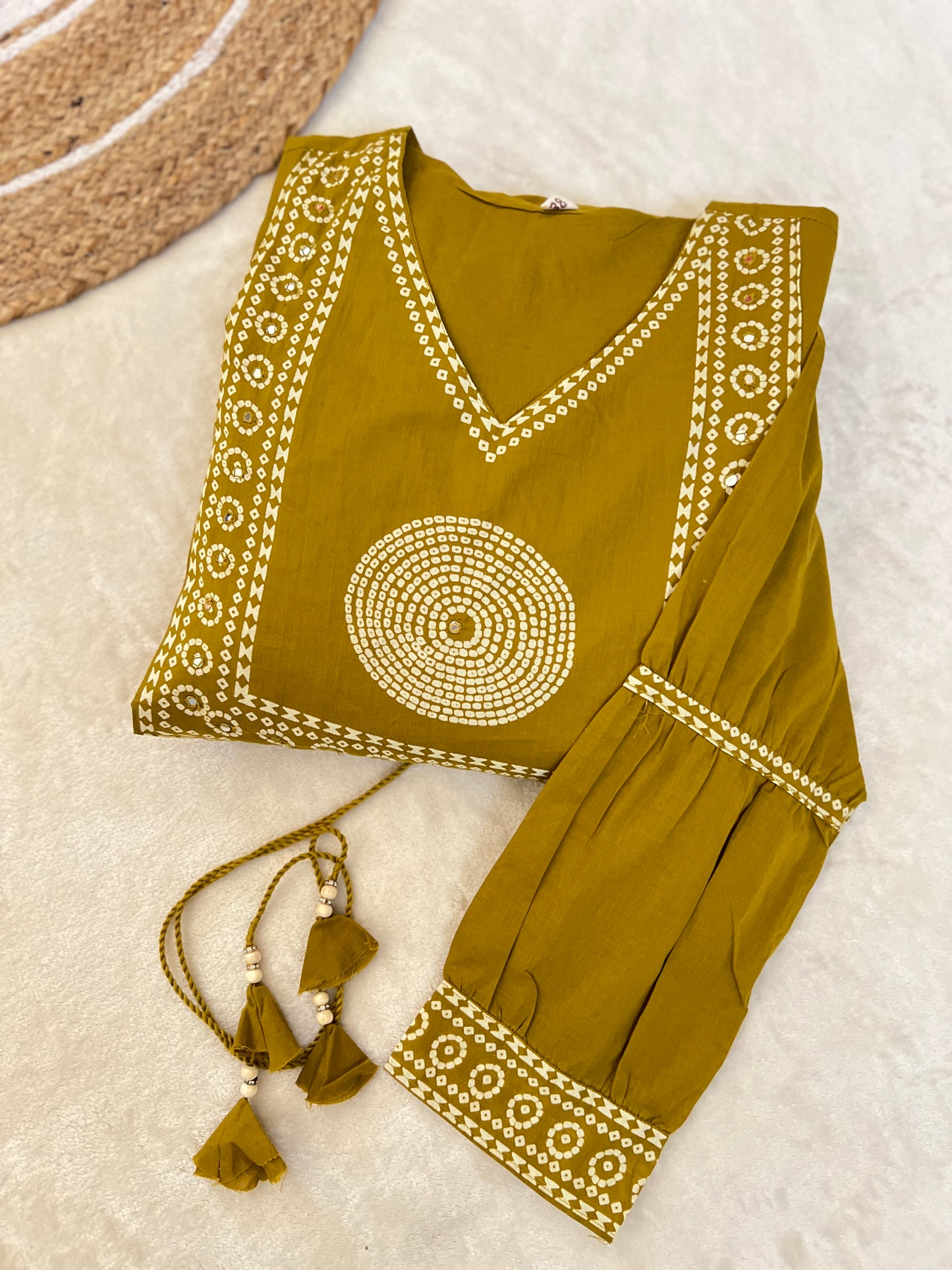 Premium cotton frock with tassels on th yoke portion balloon sleeves v neck