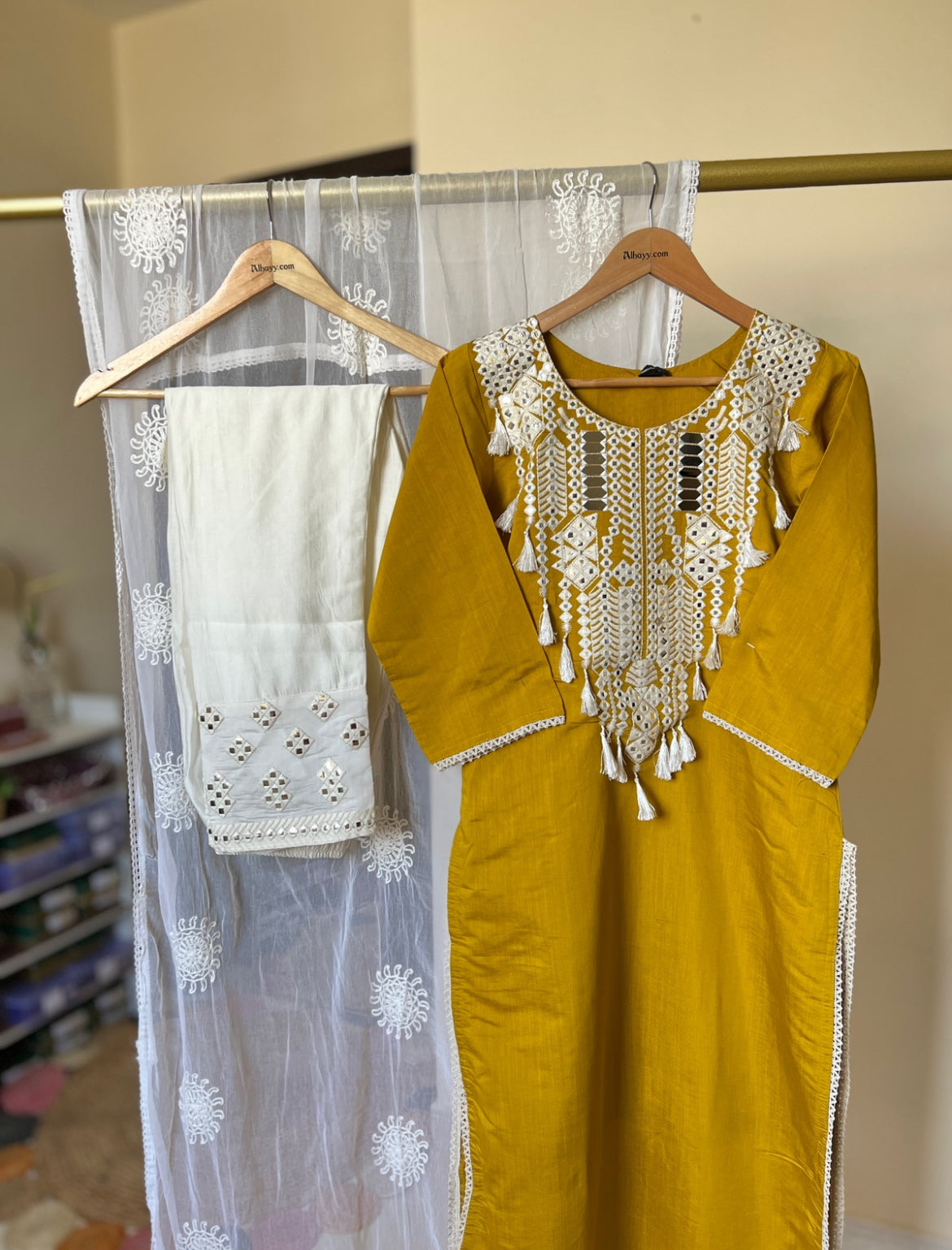 Beautiful dress in cotton silk with mirror and tassel work
