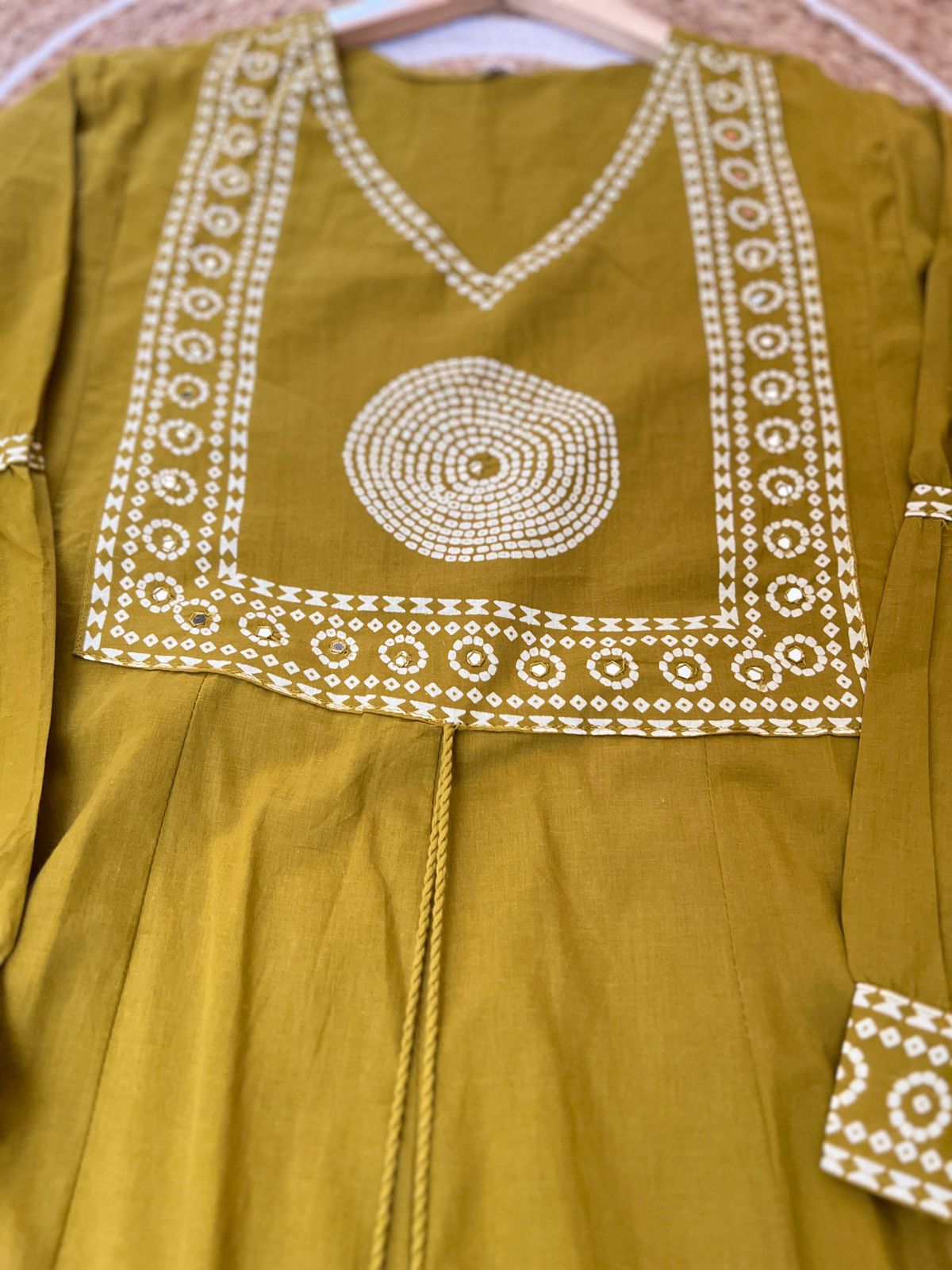 Premium cotton frock with tassels on th yoke portion balloon sleeves v neck