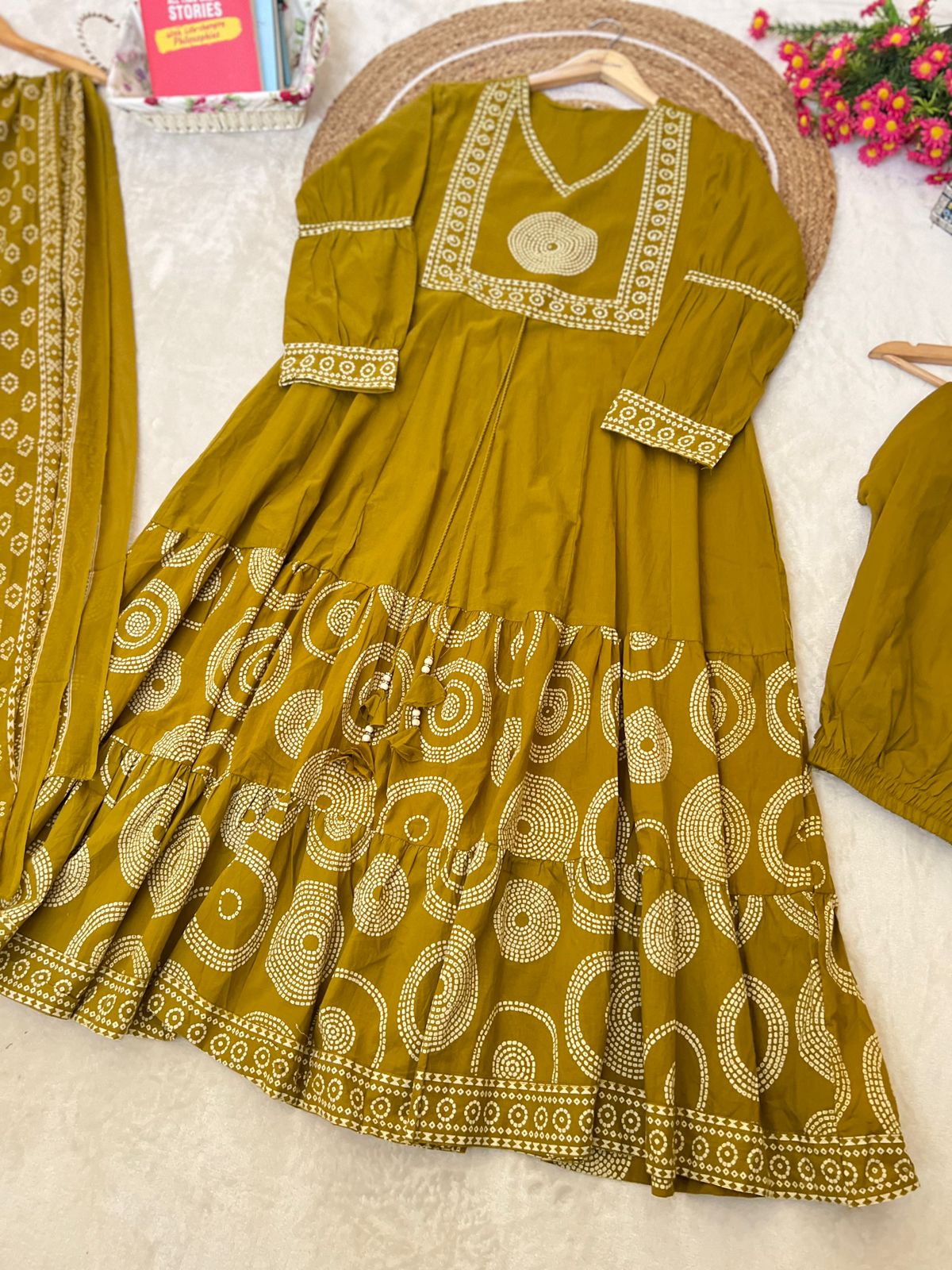 Premium cotton frock with tassels on th yoke portion balloon sleeves v neck