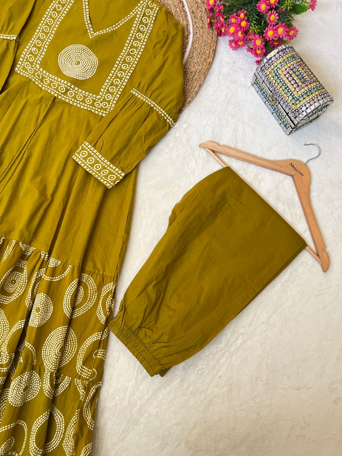 Premium cotton frock with tassels on th yoke portion balloon sleeves v neck