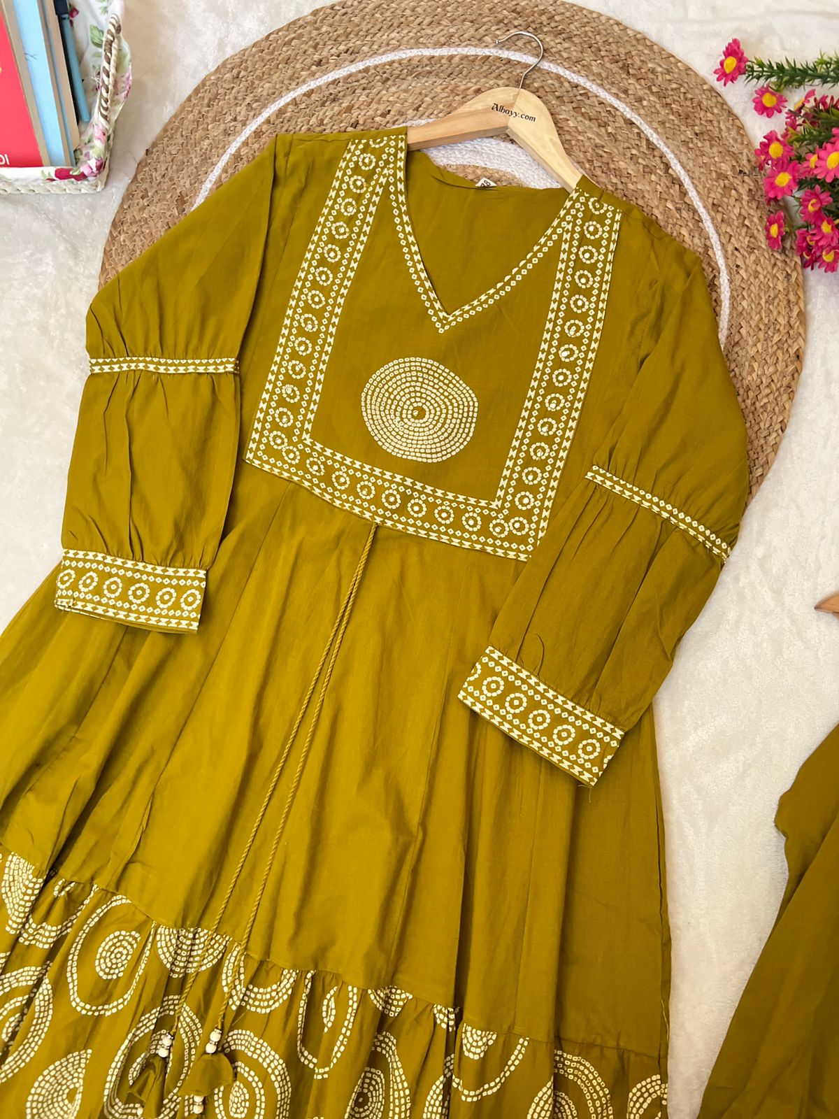 Premium cotton frock with tassels on th yoke portion balloon sleeves v neck